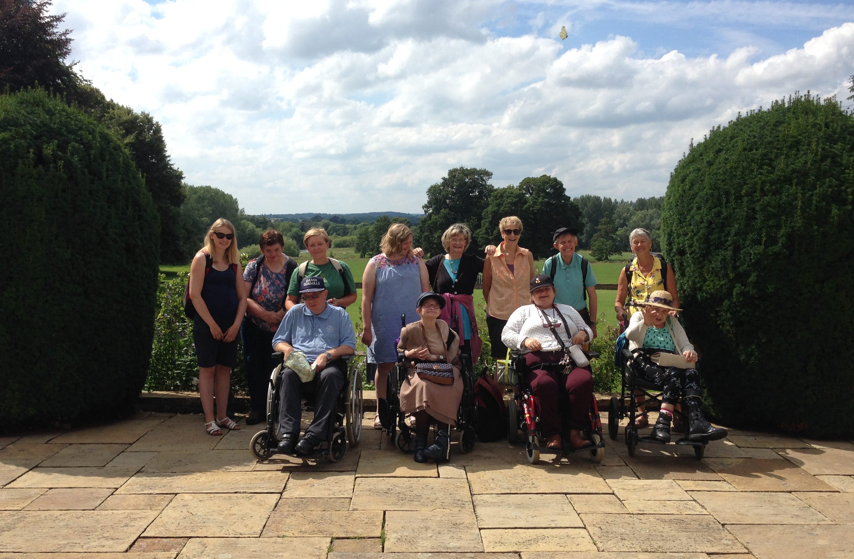 A group of wheelchair users at Newby Hall Gardens in the summer.