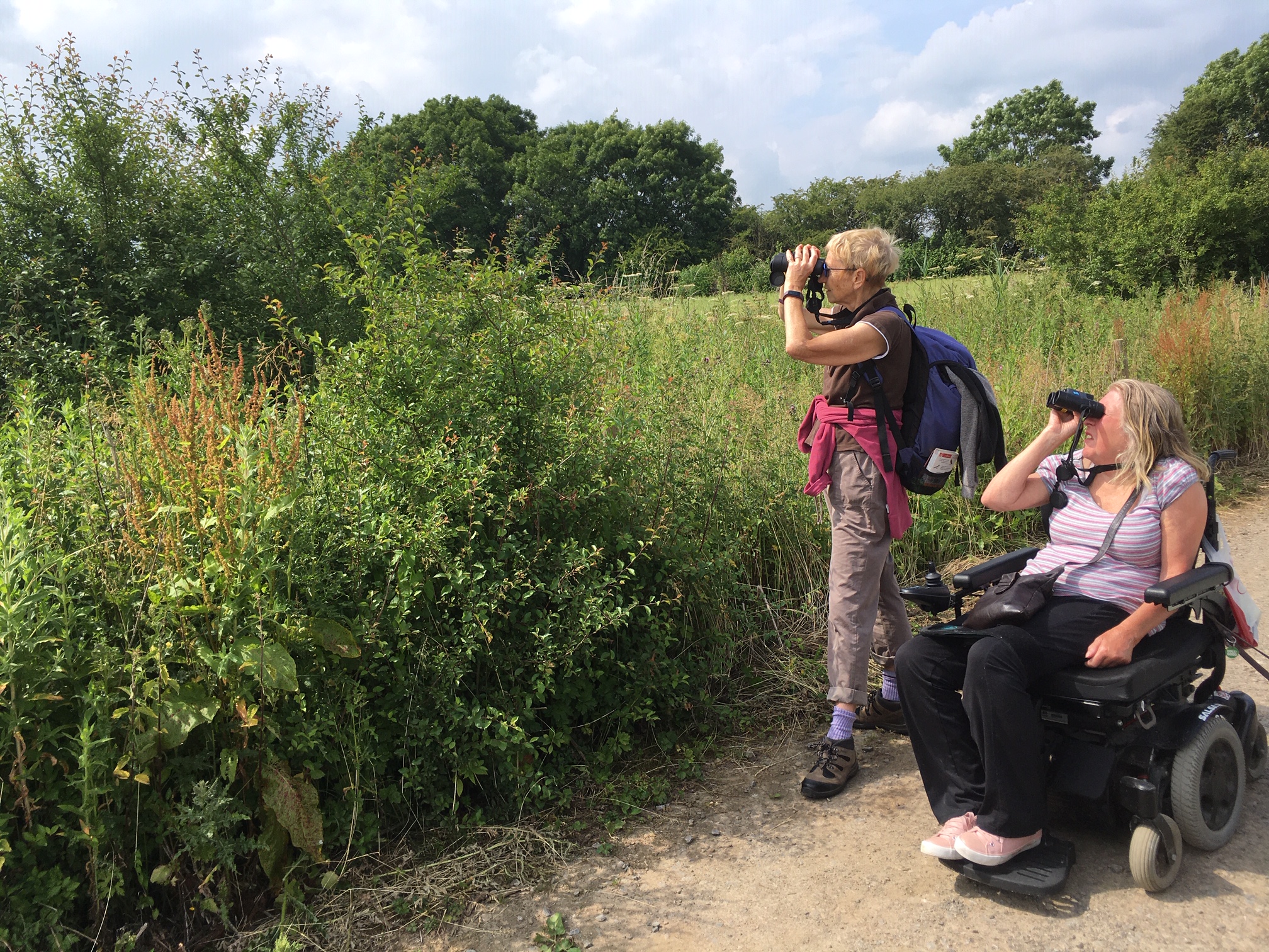 Two ladies bird watching on a nature reserve