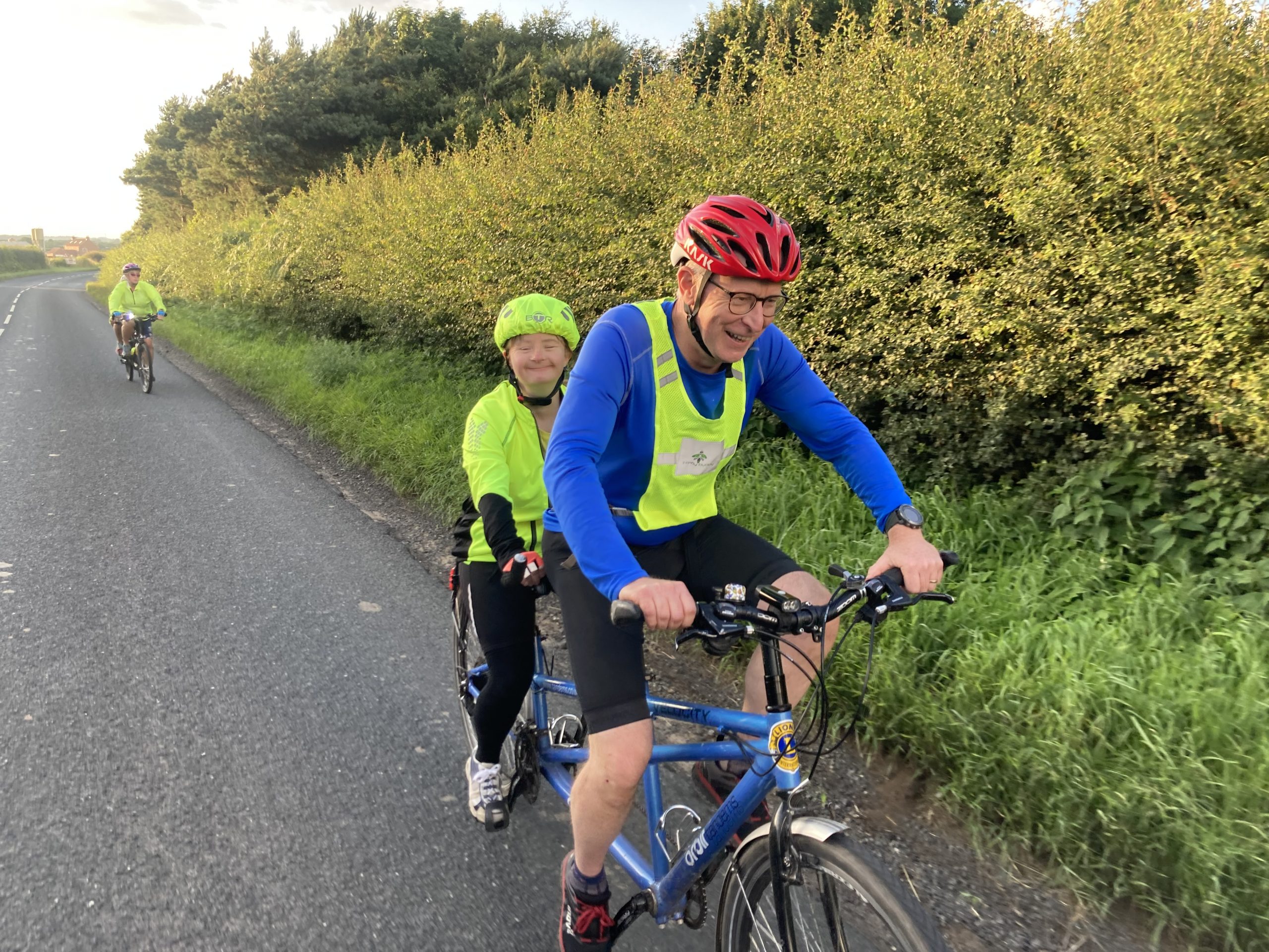 A man and a woman on a tandem