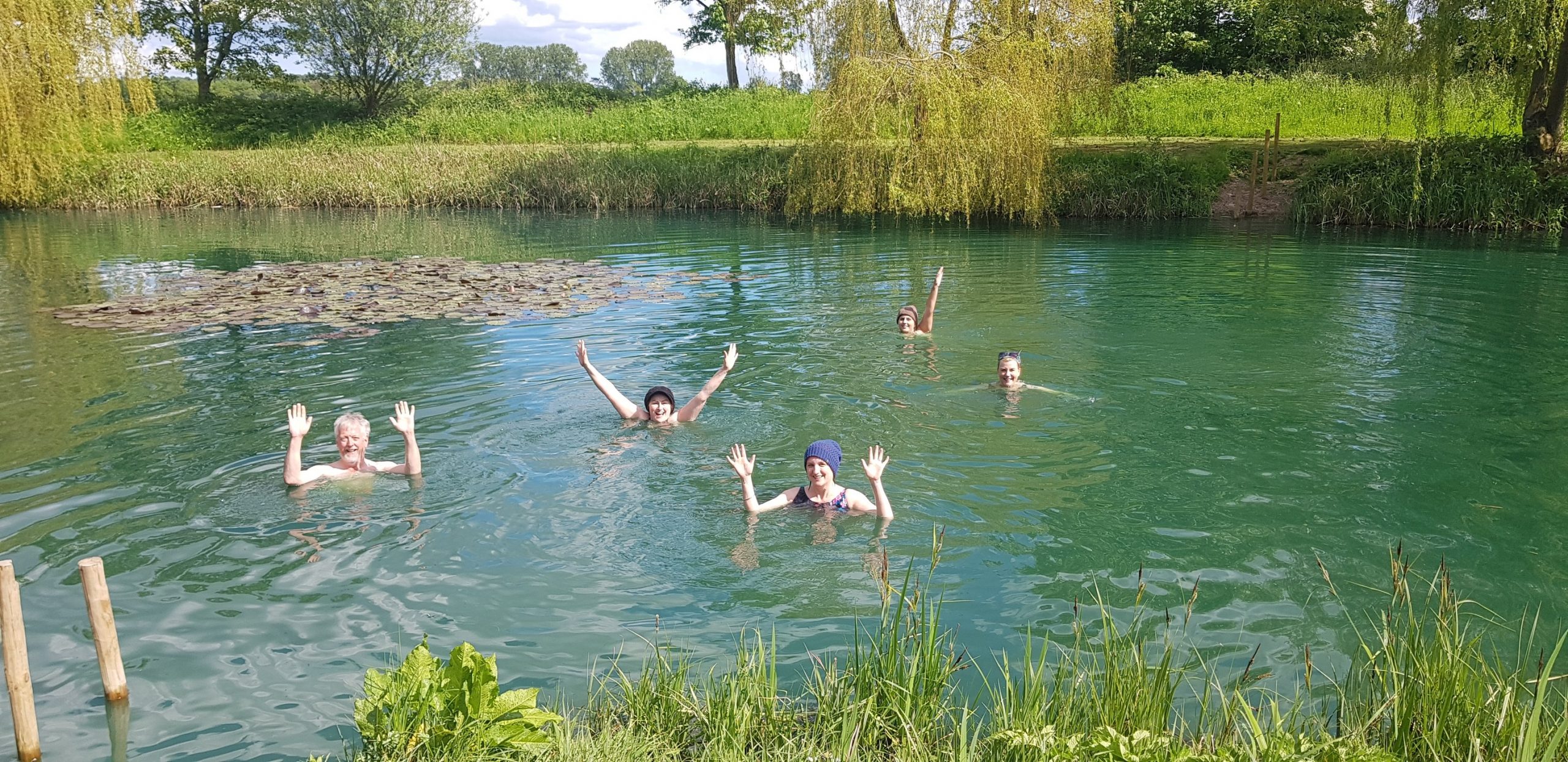 People swimming in a lake