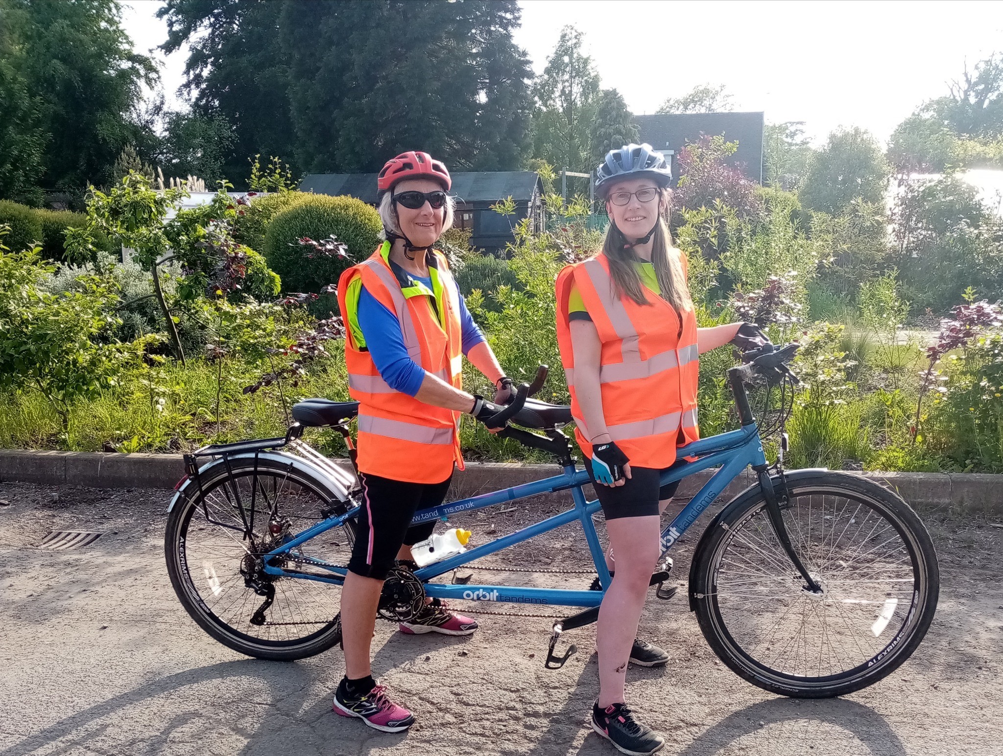 Two women on a tandem bike